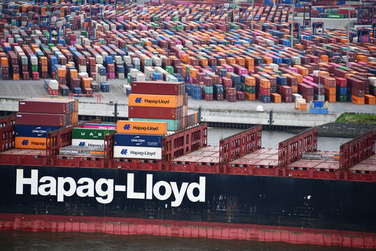Hamburg, Germany - September 16, 2024: Ship of the Hapag Lloyd shipping company in front of the Tollerort container terminal in Hamburg