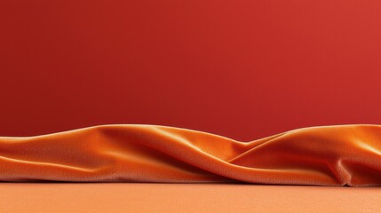 Obraz premium Orange Velvet Draped on Red Background