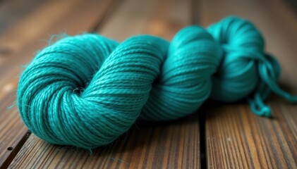 swirling skein of turquoise wool on wooden table, fiber, craft