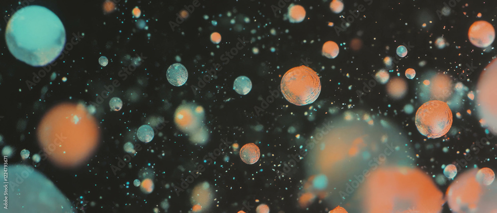 Aufkleber Clusters of bubbles with varying sizes and transparency against a black background