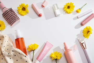 Beauty products background frame flat lay on white, spring skincare, top view, copy space