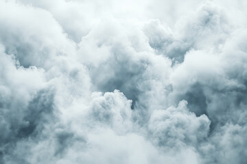 Cloudscape Abstract: A dramatic, moody close-up of dense, swirling clouds, creating a textural masterpiece of grey and white hues.  The image evokes a sense of mystery and atmospheric depth. 