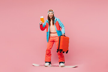 Traveler happy woman wears jacket ski goggles mask hold passport ticket bag ride snowboard isolated...