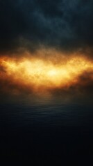 Dramatic sky over dark water with golden light creating a moody and abstract landscape