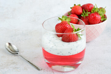 a drinking glass with a Strawberry Parfait with jelly and yogurt