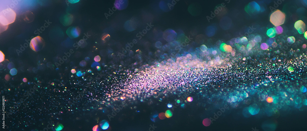 Poster glitter overlay texture featuring blurred particles and soft focus against a black background
