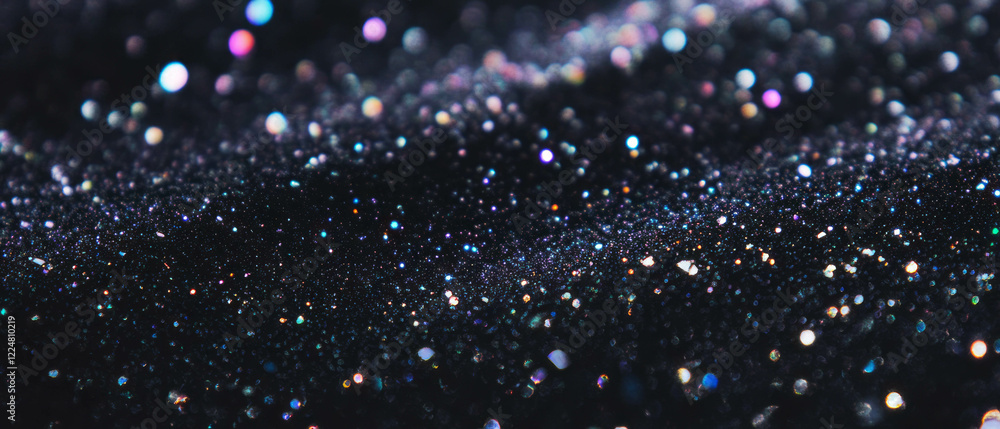 Poster glitter overlay texture creates a sparkling atmosphere against a black background