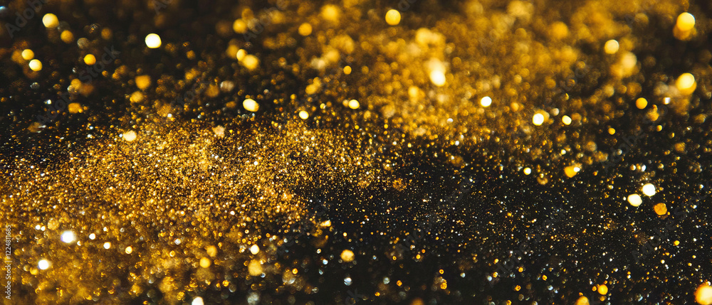 Poster luxurious golden glitter particles create a stunning sparkling texture against a black background