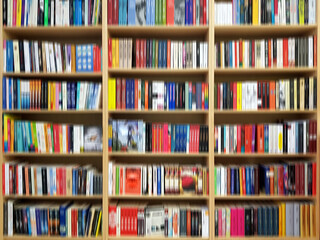 Many different books on the bookshelf. Library with bookcases