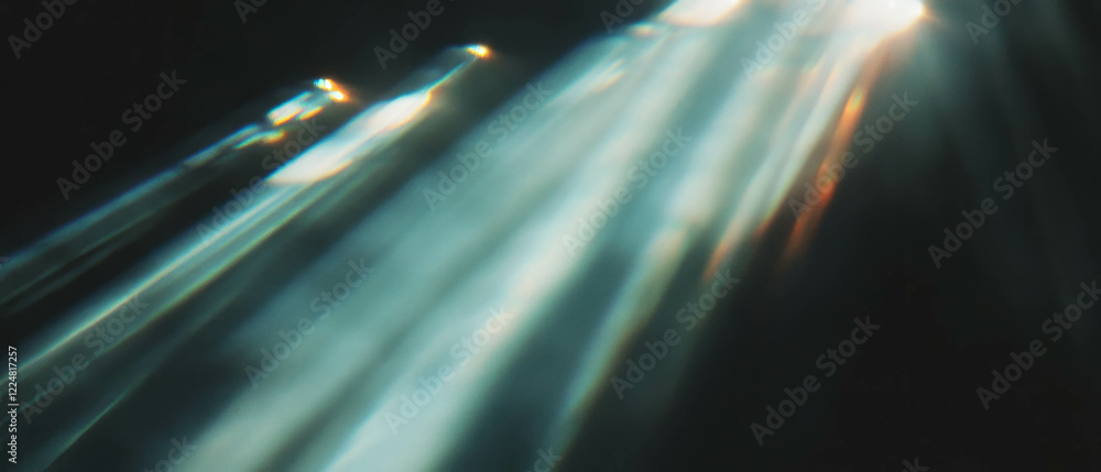 Poster Dynamic interplay of light with varying intensity against a black backdrop creating mystical effects