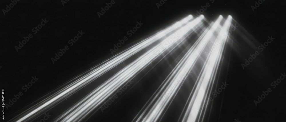 Poster rays of light create powerful illumination against a dark background for dramatic effect