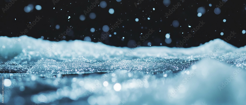 Poster Snow and frozen puddles create a shimmering effect against a dark backdrop