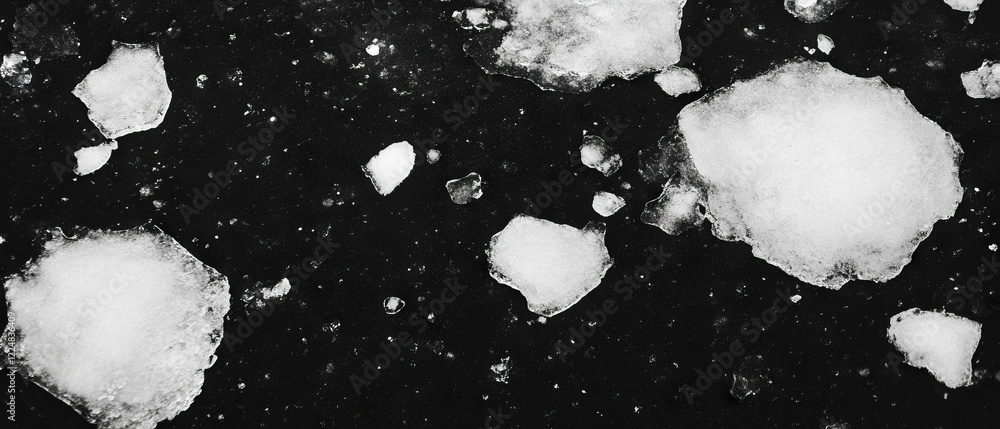 Aufkleber winter texture featuring snow and ice patches on a dark background