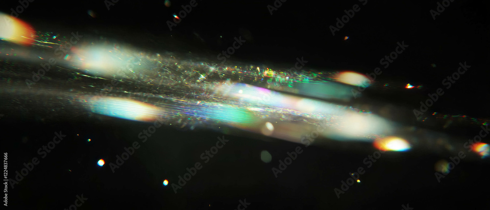 Aufkleber Soft and diffused spark glow with gentle ambient light on a black background