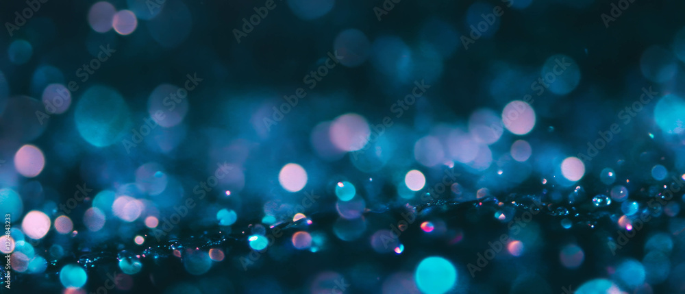 Poster soft-focused water bubbles create a gentle texture against a black backdrop