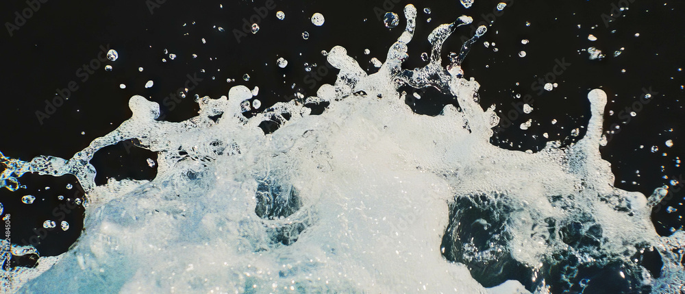 Poster dynamic wet-on-wet watercolor blending creates a striking contrast on black background