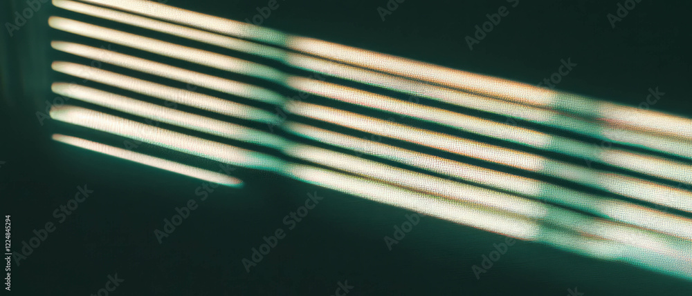 Poster Window blinds create intricate shadow patterns on a contrasting dark background