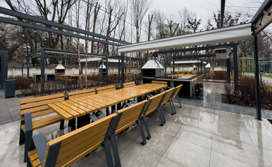 Beautiful backyard with barbeque area and dining table