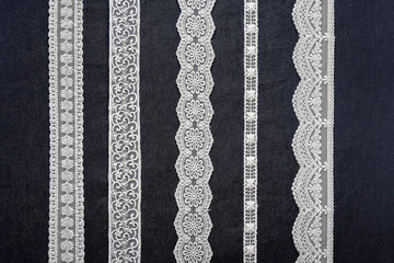 Samples of beautiful elegant lace on a black background