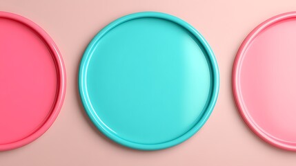 Colorful round plates in pink and turquoise arranged on a pastel background for modern dining decor