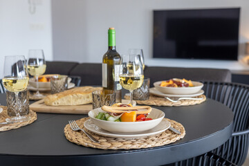 Dining Table with Food and Wine Setup