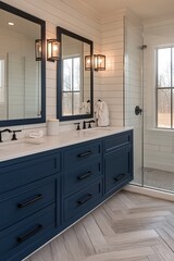 Modern bathroom interior with blue vanity double mirrors and glass shower featuring herringbone floor