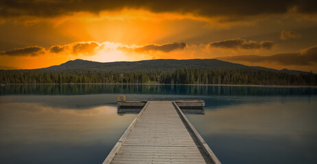 Obraz premium Wooden dock on a calm lake in British Columbia, Canada.