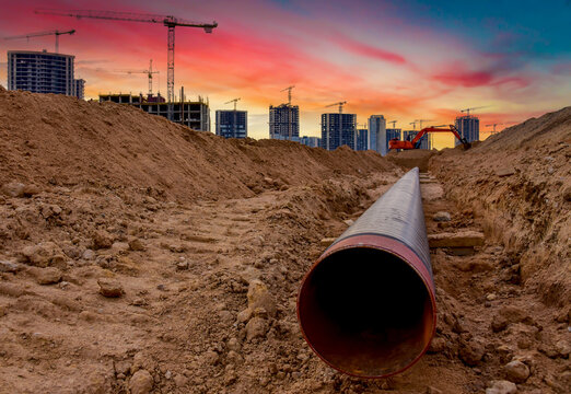 Sewer pipes for laying an external sewage system at a construction site. Sanitary drainage system for a multi-story building. Civil infrastructure pipe, water lines and storm sewers. Tower crane work