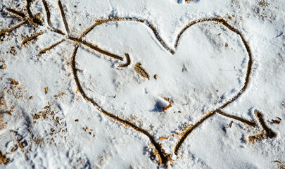 Drawn heart on snow, outline