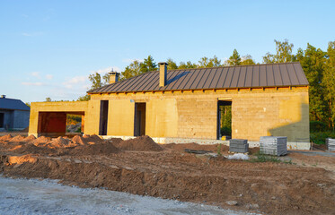 Suburban house Construction. Villa construction. New house construction. Home building. Modern...