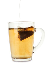 Putting tea bag into glass cup on white background
