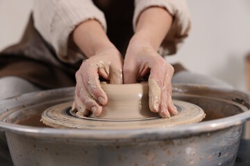 Hobby and craft. Woman making pottery indoors, closeup