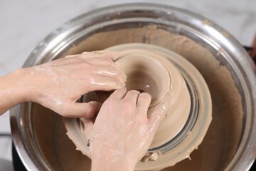 Hobby and craft. Woman making pottery indoors, closeup
