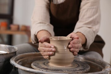 Hobby and craft. Woman making pottery indoors, closeup