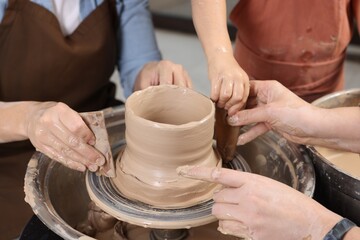 Hobby and craft. Women with girl making pottery indoors, closeup