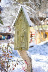 Small decorative house in a winter park