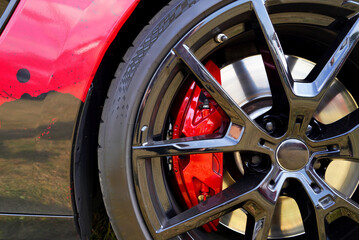 Alloy wheel with calipers and racing brakes of the sport car. Racing brake disc and low profile...