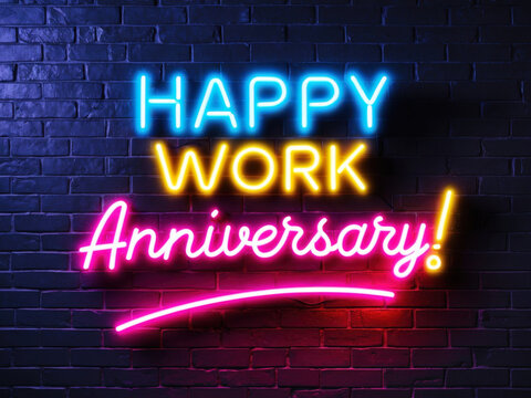 Bright neon work anniversary sign glowing against a dark blue brick wall. perfect for workplace appreciation visuals, corporate greetings, and digital party invites.