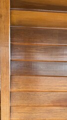 Rustic Wooden Texture: Close-up of a rich, warm wooden slatted surface, showcasing the natural grain and texture of the wood, ideal for rustic or country-themed design projects.  