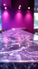 Purple marble surface with three lights on a wall in a modern interior design setting