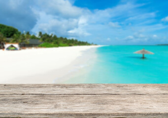 Wooden table top on the beach or sea.Party on the beach  sunshine time concept.For montage product display or design key visual layout.View of copy space.