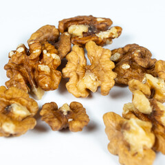 Shelled walnuts on a white background close-up