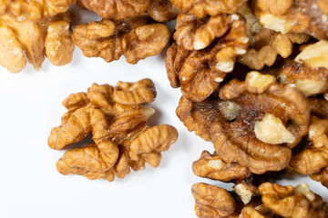 Shelled walnuts on a white background close-up