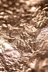 A Shiny Foil Crumpled in Sharp Crumpled Metallic Gloss Background  Gold