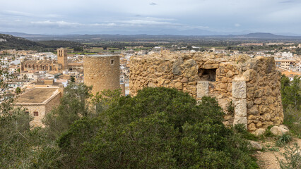 Remains of the old windmill Moli d'en Xeta and behind it the restored mill tower Moli d'en Veny above Felanitx, Mallorca, Balearic Islands, Spain