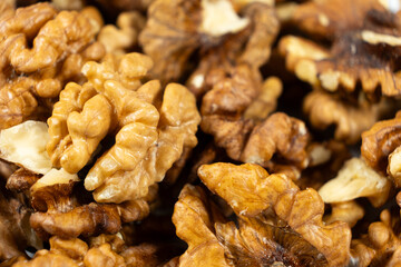 Pile of peeled raw unroasted walnuts.