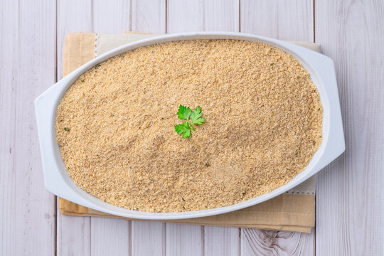 Farofa, typical brazilian manioc flour side dish over wooden table