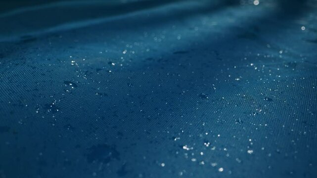 Tranquil Water Surface with Raindrops in Beautiful Blue Hues Captivating the Mind