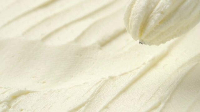 Close-up knife scooping natural cream cheese from package, concept video