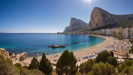 Fototapeta premium Breathtaking coastal view of Calpe Spain featuring stunning beaches and majestic cliffs under a clear blue sky
